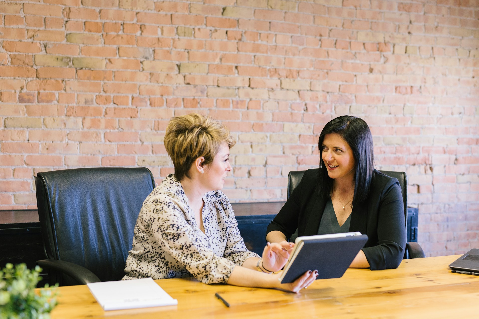 2026_10 Unlocking Potential with PI Inspire Two women talking in an office